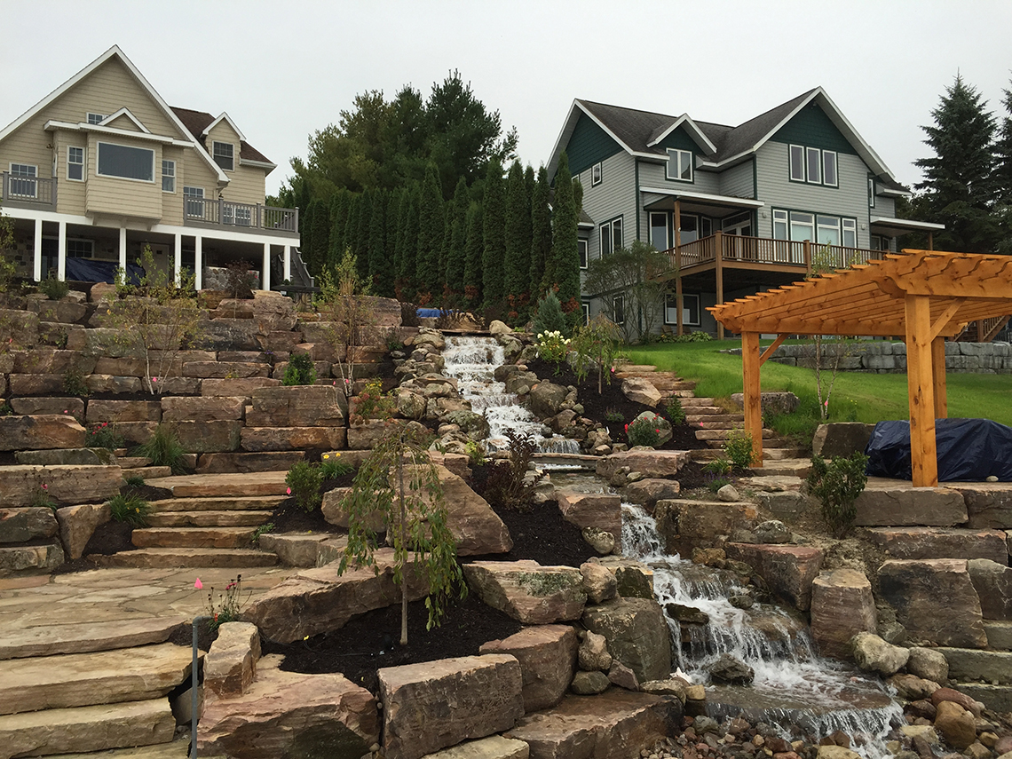 Patios, Pergola, Waterfall and Young Plantings