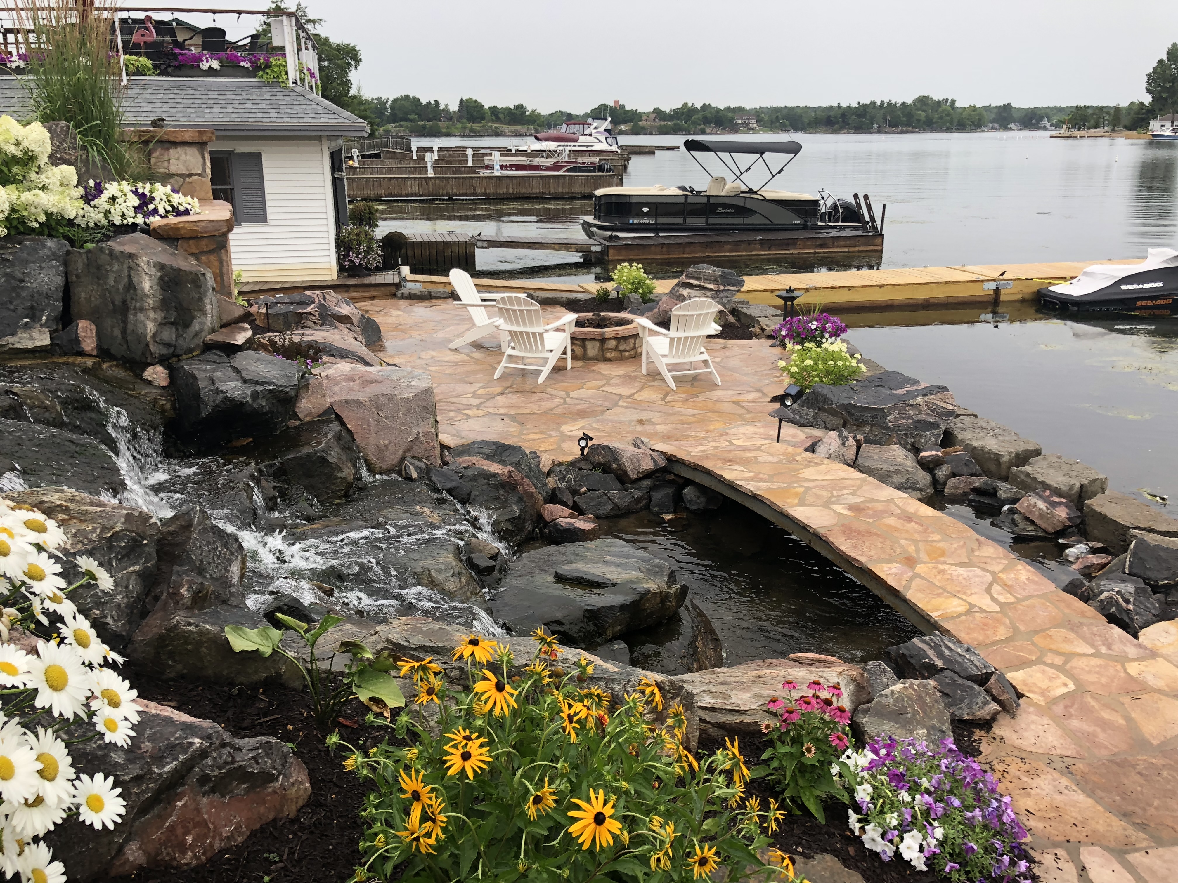 Flagstone Patio & Bridge with Waterfall and Fire Pit