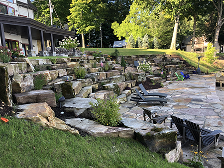 Flagstone Patio with a Boulder Terrace and Mortared Sandstone Seawall